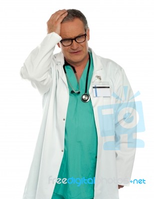 Crying Senior Doctor Stock Photo