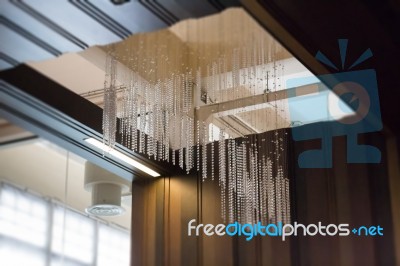 Crystal Line Mobiles Chandelier From Ceiling Stock Photo