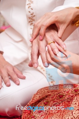 Cultural Thai Wedding Groom Putting Ring Stock Photo