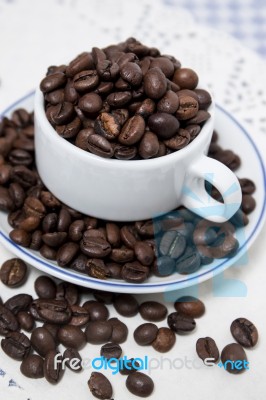 Cup Full Of Coffee Beans Stock Photo