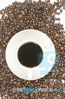 Cup Of Coffee On Beans Stock Photo
