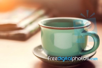 Cup Of Dust On Desk Stock Photo