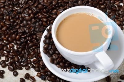 Cup Of Hot Coffee And Beans Stock Photo