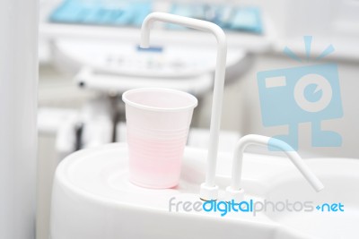 Cup Of Water In Dental Clinic Stock Photo