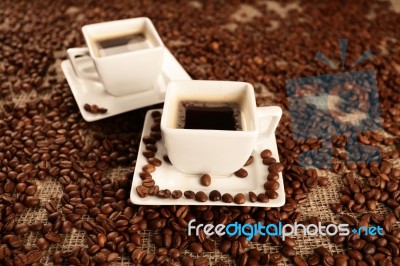 Cups With Coffee And Coffee Beans Stock Photo