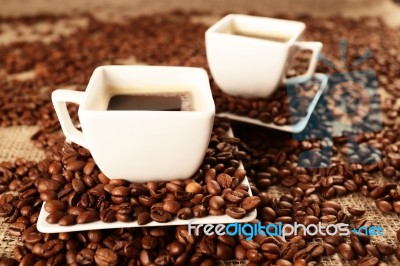 Cups With Coffee And Coffee Beans Stock Photo