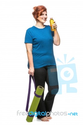 Curvy Woman Carrying Yoga Mat Stock Photo