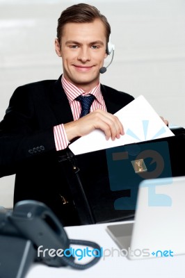 Customer Care Person Arranging Office Documents Stock Photo