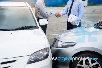 Customer Shake Hand With Auto Insurance Agents After Agreeing To… Stock Photo