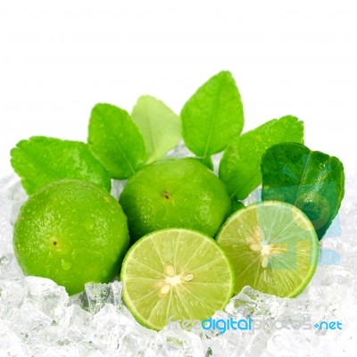 Cut Lime (citrus Aurantifolia (christm.)  Swingle) And Ice On Wh… Stock Photo