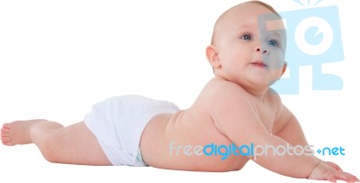 Cute Baby Boy Looking Away While Lying Down Stock Photo