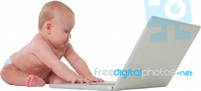 Cute Baby Boy Using Laptop Computer Stock Photo