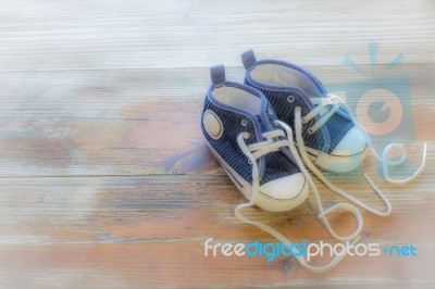 Cute Baby Shoes With The Word Love Written With The Laces Stock Photo