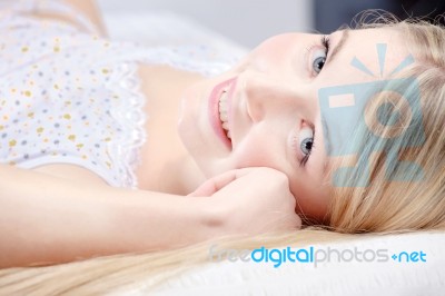 Cute Blond Girl On Pillow Stock Photo