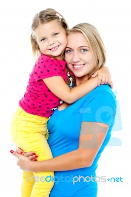 Cute Daughter Hugging Her Mom. Casual Shot Stock Photo