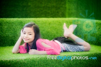 Cute Girl In Green Nature Hammock Stock Photo