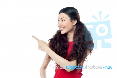 Cute Girl Pointing At Something Stock Photo
