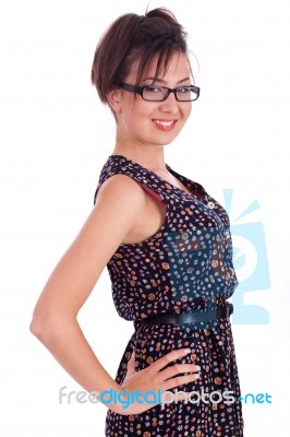 Cute Girl Wearing Spectacles With Hands On Hips Stock Photo