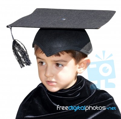 Cute Kid Graduate With Graduation Cap Stock Photo