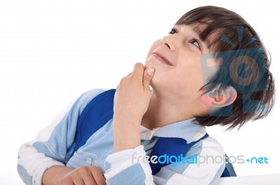 Cute Kid Thinking And Looking Up Stock Photo