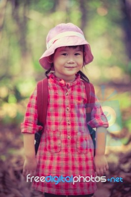 Cute Little Asian Girl Looking At Camera And Smiling Over Nature… Stock Photo