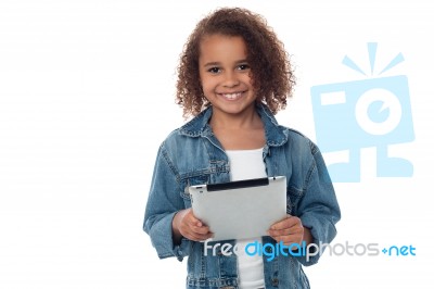 Cute Little Girl Holding Tablet Pc Stock Photo
