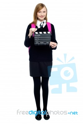 Cute School Girl With A Clapperboard Stock Photo