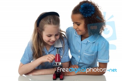 Cute School Girls With Microscope Stock Photo