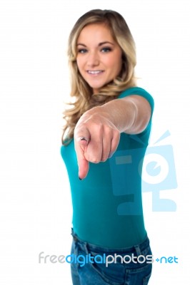 Cute Young Girl Pointing You Out Stock Photo