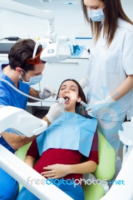 Cute Young Woman At The Dentist. Mouth Checkup Stock Photo