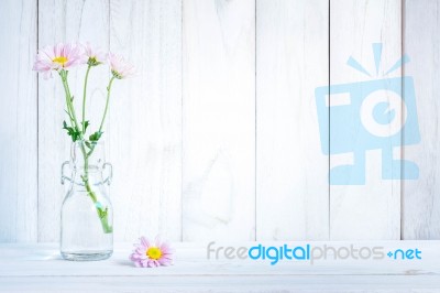 Daisies In Vase On A Old Wooden Table Stock Photo
