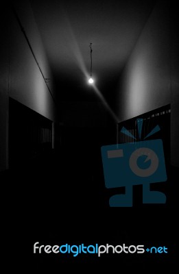 Dark Hallway With A Single Light Stock Photo