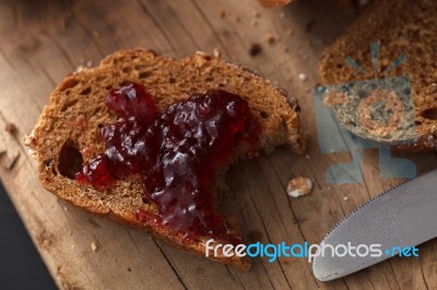 Dark Multigrain Bread Whole Grain And Jam Fresh Baked On Rustic Closeup Stock Photo