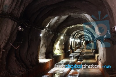 Dark Tunnel With Light Stock Photo