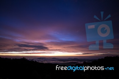 Dawn Betweem The Clouds Stock Photo