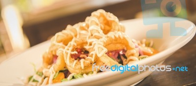 Deep Fried Calamari Rings And Salad Stock Photo