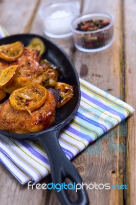 Delicious Baked Chicken Thighs With Lemon Slices, Onion And Zucchini Stock Photo