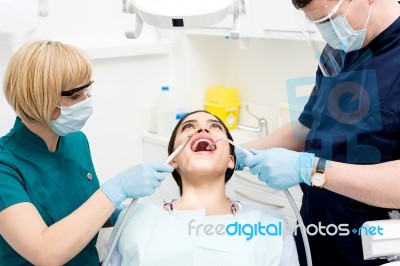 Dental Cleaning, Woman Under Treatment Stock Photo