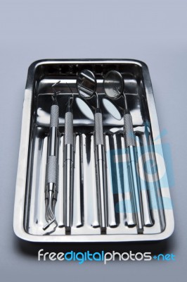 Dental Tools On Plate Stock Photo