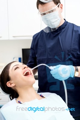 Dentist Examine On A Female Patient Stock Photo