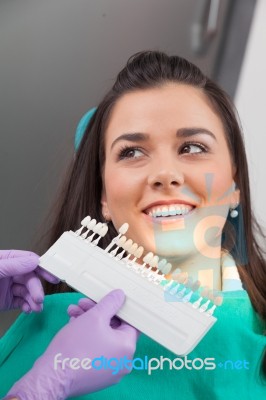 Dentist Examining A Patient's Teeth In The Dentist Stock Photo