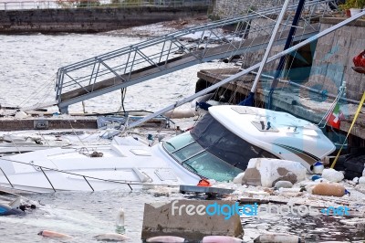 Destroyed  By Thunderstorm Piers With Boats In Verbania, Italy Stock Photo