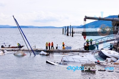 Destroyed  By Thunderstorm Piers With Boats In Verbania, Italy Stock Photo