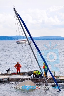 Destroyed  By Thunderstorm Piers With Boats In Verbania, Italy Stock Photo