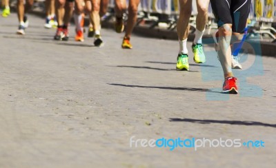 Detail Of A Group Of Runners During A City Marathon Stock Photo