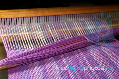 Detail Of Fabric In Comb Loom With Ultraviolet And Lilac Colors Stock Photo