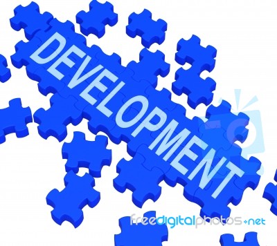Development Puzzle Shows Business Improvement Stock Image