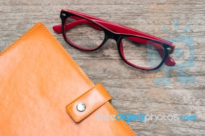 Diary Booklet And Eye Glasses On Wooden Desk Stock Photo Diary Booklet And Eye Glasses On Wooden Desk Stock Photo