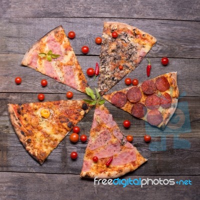 Diferent Pizza Parts On Table Stock Photo