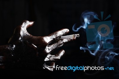 Dirty Hand With Cigarette Isolated On Black Background Stock Photo